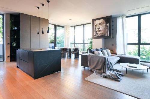a living room with a couch and a table at Luxury Suite in Bosco Verticale Milano Isola in Milan