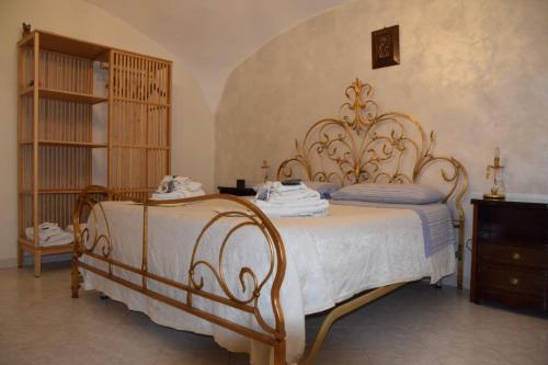a bedroom with a bed with a white bedspread at Civico 30 in Naples