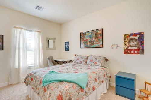 a bedroom with a bed and a table and a window at Quaint Noble Home 6 Mi to University of Oklahoma! in Norman