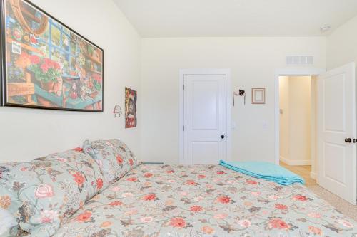 a living room with a couch and a painting on the wall at Quaint Noble Home 6 Mi to University of Oklahoma! in Norman