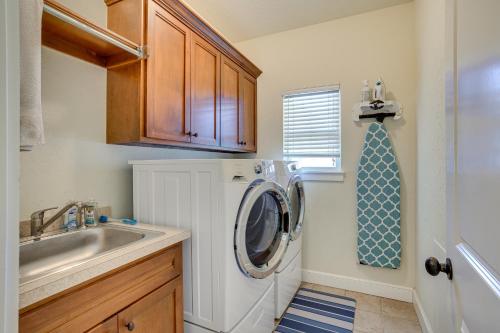 a kitchen with a washing machine and a sink at Quaint Noble Home 6 Mi to University of Oklahoma! in Norman