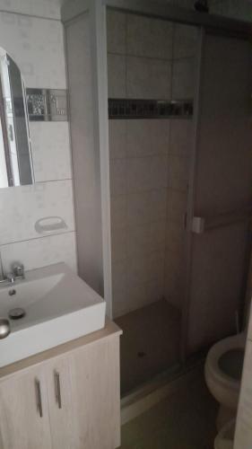 a bathroom with a shower and a sink and a toilet at DEPARTAMENTOS AMOBLADOS EN JOSE LUIS BUSTAMANTE Y RIVERO AREQUIPA -PERU in Arequipa