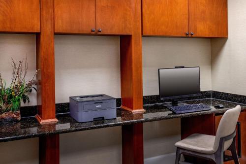 an office with a desk with a computer and a chair at SpringHill Suites by Marriott Norfolk Virginia Beach in Virginia Beach