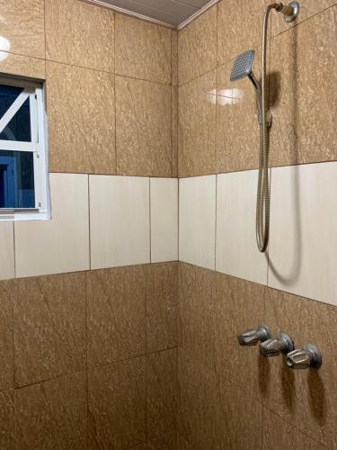 a shower in a bathroom with a glass door at Cozy first floor accommodation 4 guests 1 bedroom in Georgetown
