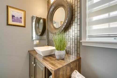 a bathroom with a sink and a mirror at New Jersey Home - Deck, Grill and Walkable to Beach! in Ship Bottom