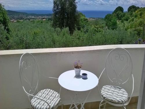 a white table and two chairs on a balcony at B&B Villa Ada in Formia