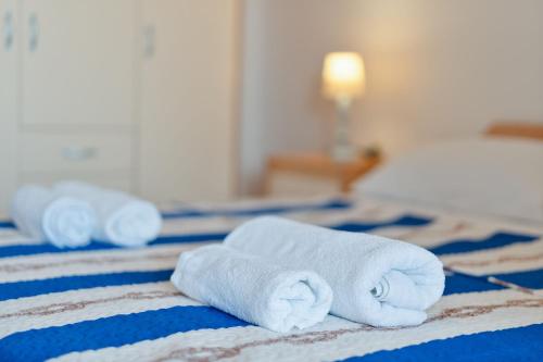 Ένα ή περισσότερα κρεβάτια σε δωμάτιο στο Apartments Luka