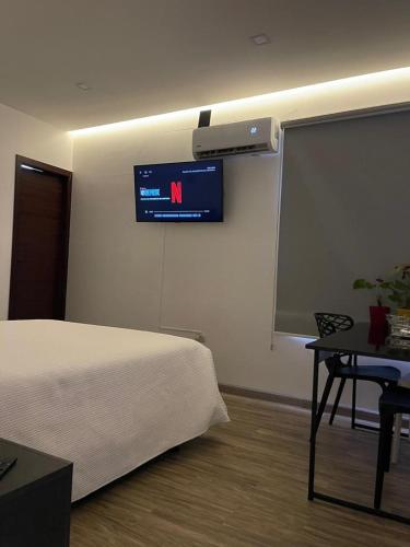 Ein Bett oder Betten in einem Zimmer der Unterkunft Kiran Lodging Guayaquil