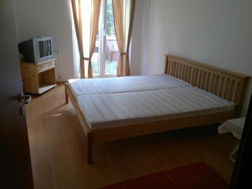 Posteľ alebo postele v izbe v ubytovaní Villa Palazzo Apartments