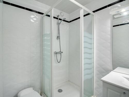a bathroom with a shower and a toilet and a sink at Appartement La Mongie, 2 pièces, 7 personnes - FR-1-404-160 in La Mongie
