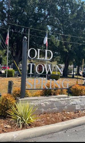 a sign for the old hollywood sign in a park at 2 bed 2 bath Modern Farmhouse in Old Town Spring in Spring