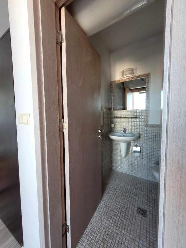a bathroom with a sink and a toilet at Rainbow 3 Sunny Beach Topo Apartment in Sunny Beach