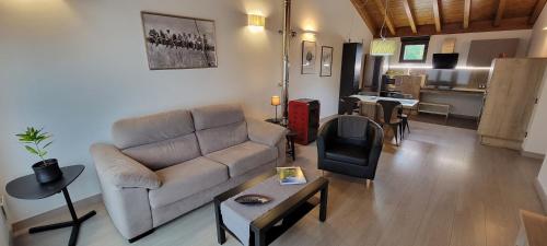 a living room with a couch and a table at Apartamentos Rurales Argame in Argamé