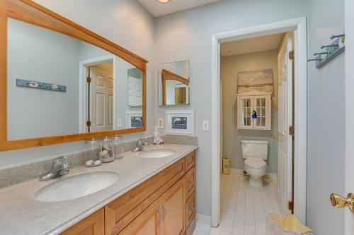 a bathroom with two sinks and a toilet at 2 Mi to Beach Hilton Head Home with Furnished Deck in Hilton Head Island