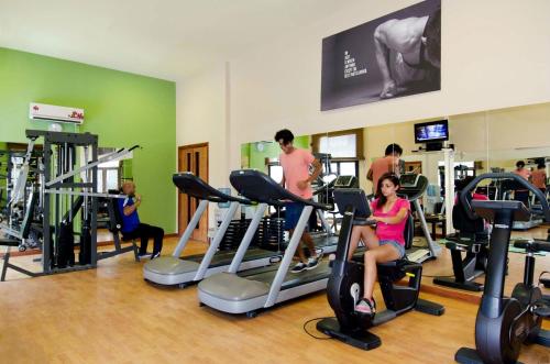 a group of people exercising on treadmills in a gym at Swiss Inn Teda Hotel & Aqua Park in Ain Sokhna