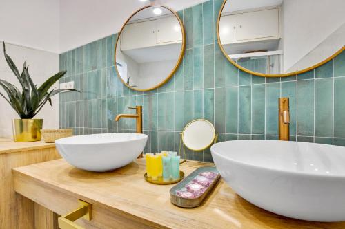 a bathroom with a white sink and a mirror at Casa de la Playa. Beach House with magnificent sea in Málaga
