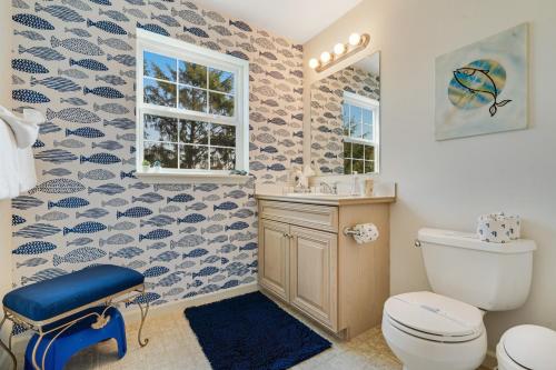 a bathroom with a toilet and a sink at Condra Cove in Copalis Beach