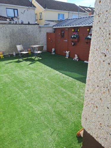 a backyard with a lawn with teddy bears on it at Willows Retreat in Dublin
