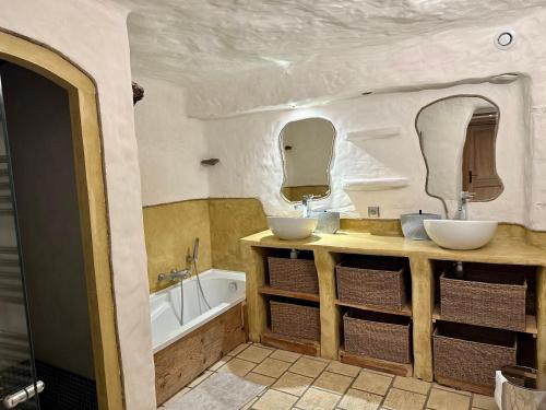 a bathroom with two sinks and a tub at Chalet haut de gamme 5 chambres avec hammam, proche des pistes - FR-1-293-211 in Villard-sur-Doron