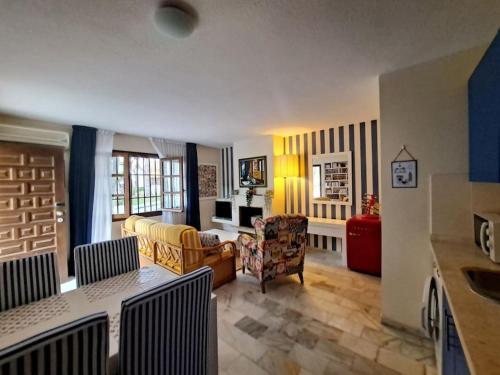 Et opholdsområde på Vera Shore 4 persons 2 pools and beach 200 m