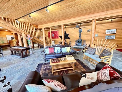 a large living room with couches and a piano at The Lodge at Lolo Hot Springs in Lolo