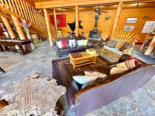 a living room with a couch and a table at The Lodge at Lolo Hot Springs in Lolo