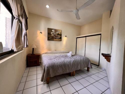 Ein Bett oder Betten in einem Zimmer der Unterkunft Hotel Palmeras