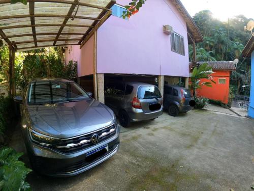 a car parked in a garage next to a house at Pousada do Riacho Trindade in Trindade