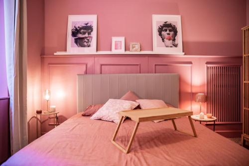 a bedroom with a bed with a table on it at Telesio Suite in Rome