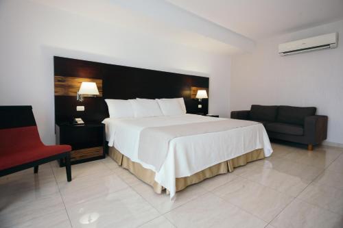 Postel nebo postele na pokoji v ubytování Hotel Balandra