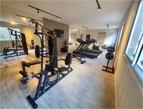 a gym with several treadmills and machines in a room at MV 77A Incrível Apartamento Em Frente Ao Metrô Brás ! - Rua Coronel Mursa, 56 - Bras in Sao Paulo