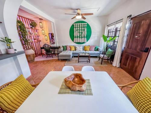 a living room with a white table and chairs at Casa Paloma - Zona Romantica in Puerto Vallarta