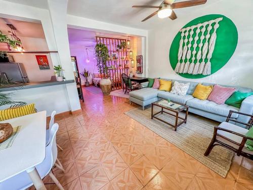 a living room with a couch and a table at Casa Paloma - Zona Romantica in Puerto Vallarta