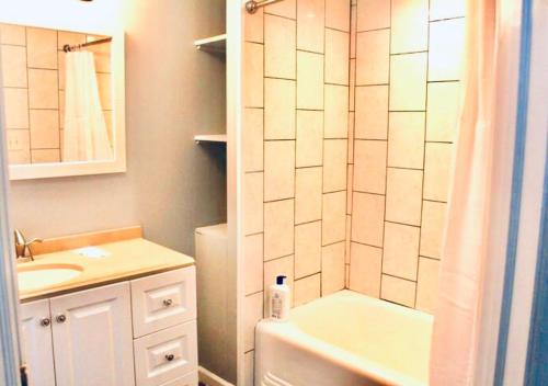 a small bathroom with a sink and a shower at Clover 2900 - Apartment and Rooms with Private Bathroom near Washington Ave South Philly in Philadelphia