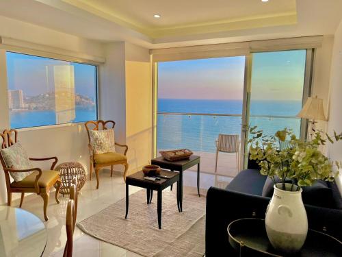 a living room with a view of the ocean at Sunset View Malecón 1404 Vista panoramica al mar in Mazatlán