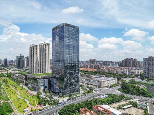 an aerial view of a tall building in a city at Shantou Marriott Hotel in Shantou