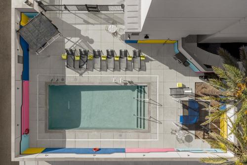 an overhead view of a swimming pool in a building at Aloft Tucson University in Tucson