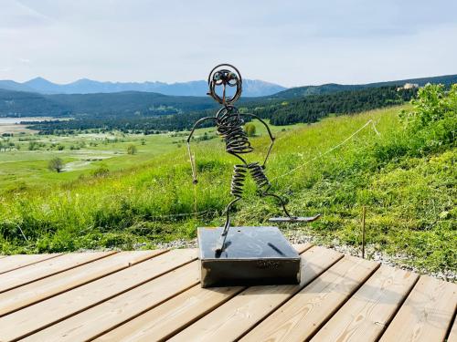 a piece of equipment sitting on top of a wooden table at Artik chalet avec vue à 180 degrés et piscine in Les Angles