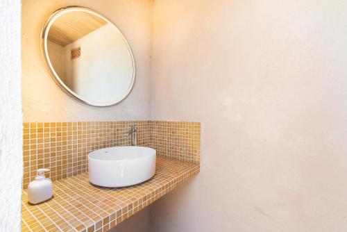 a bathroom with a sink and a mirror at Finca Son Blat in Porto Cristo