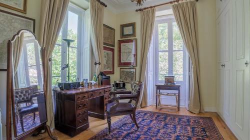 a home office with a desk and a mirror at Luxurious royal estate in historic Sintra paradise in Sintra