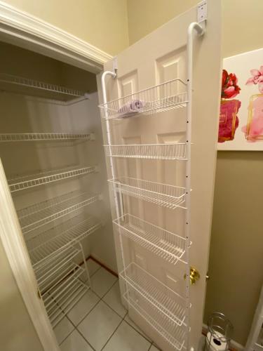 a refrigerator with empty shelves in a kitchen at Whitfield Manor in Lexington