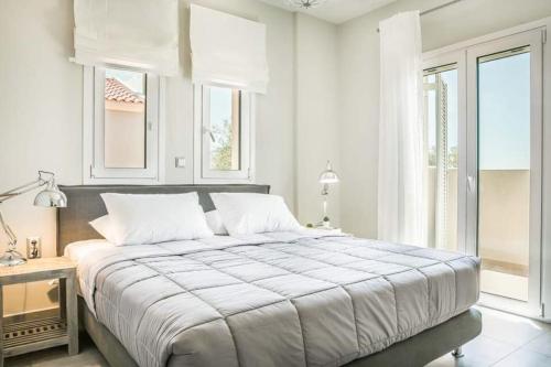 Postel nebo postele na pokoji v ubytování Villa Briseis