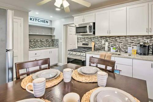 a kitchen with a table and chairs and a kitchen with white cabinets at Private Oasis (1bdr/1bth) AVIS Discount Available in Atlanta