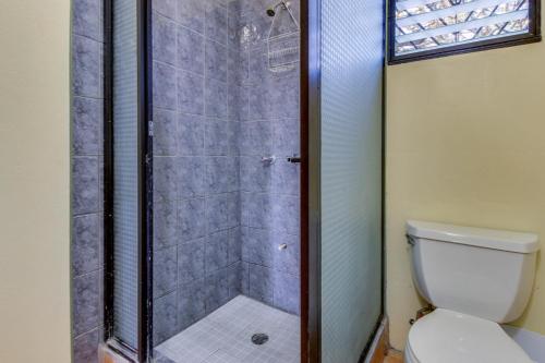 a shower stall in a bathroom with a toilet at Villa Maya Gold Standard and Certified in San Ignacio