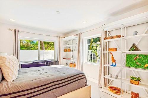 a bedroom with a bed and a window at Coconut Grove, Miami FL in Miami