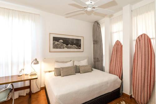 a bedroom with a bed and a ceiling fan at Authentic Loft Retreat Steps from Beach & Culture in San José del Cabo
