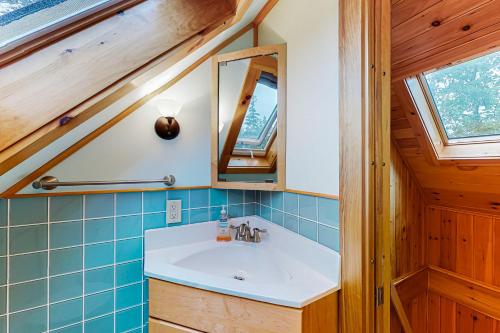 a bathroom with a sink and a mirror at Lone Maple in Port Clyde