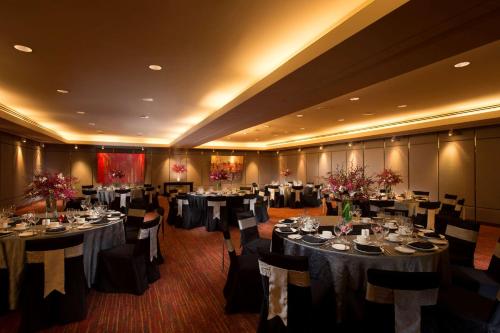 a large banquet room with tables and chairs at DoubleTree By Hilton Kuala Lumpur in Kuala Lumpur