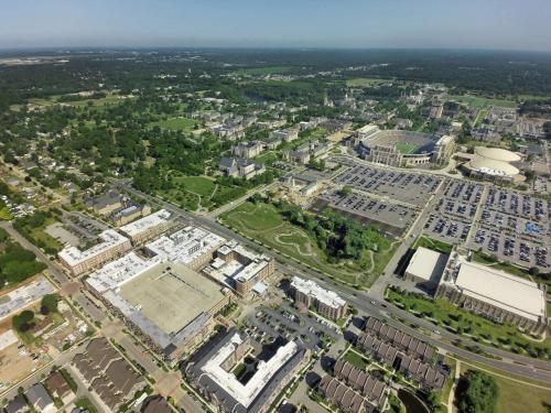 an aerial view of a city with a tennis court at Embassy Suites by Hilton South Bend in South Bend