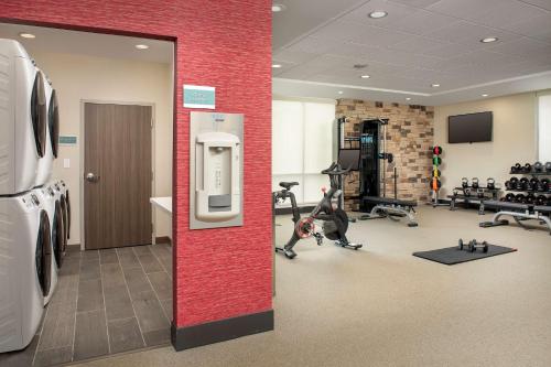 a fitness room with a gym with tread machines at Home2 Suites By Hilton Columbus Polaris in Columbus